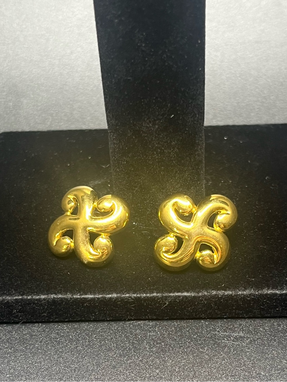 Vintage Trifari gold tone swirl knot stud earrings signed